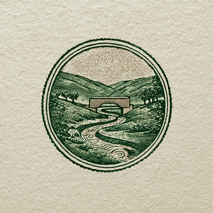 Take Me Back bookplate emblem — a river winding through the valley to a covered bridge